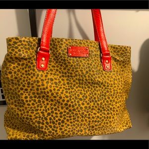 Kate Spade animal print bag. Red handles and purple lining.